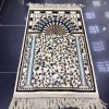 A prayer rug inspired by the carpet design of the Al-Rawdah Al-Sharifa in the Al-Nabawi Mosque